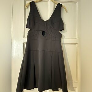 BCBG black mini dress with cutout detail, size 4.